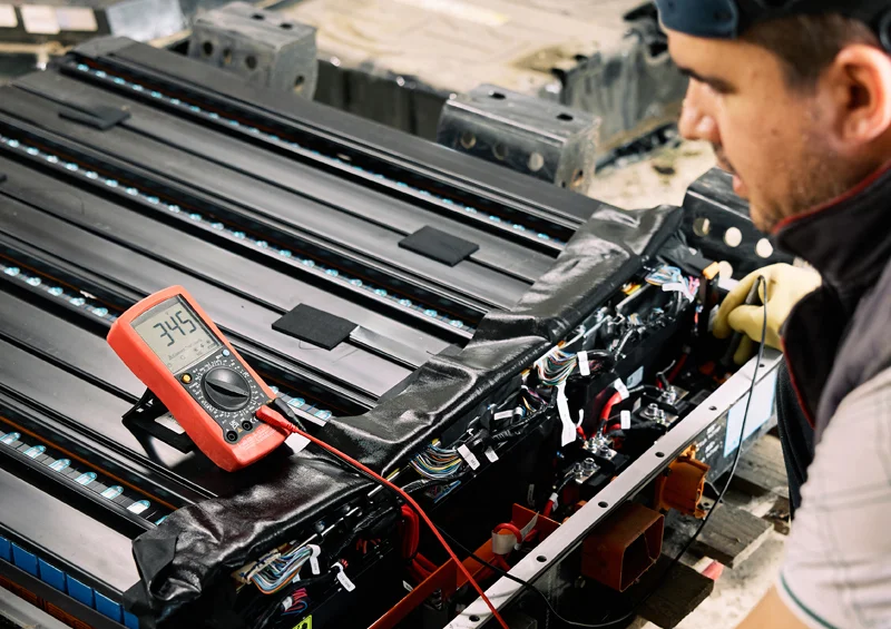 RMA - technician repairs electric vehicle battery pack
